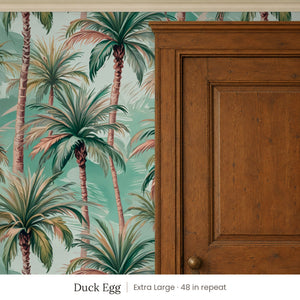 Palm Duck Egg peel and stick wallpaper, extra large 48 in repeat, beside a dark wood panel door