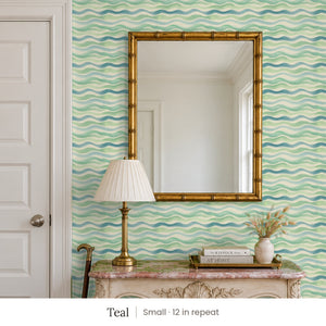 Lyme Teal peel and stick wallpaper, small 12 in repeat, in an entry with a gold mirror and a carved console