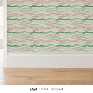 Lyme Mint peel and stick wallpaper, small 12 in repeat, above a white baseboard and oak floor
