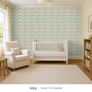 Lyme Mint peel and stick wallpaper, small 12 in repeat, in a nursery with a white crib and an armchair