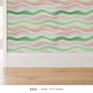 Lyme Mint peel and stick wallpaper, large 24 in repeat, above a white baseboard and oak floor