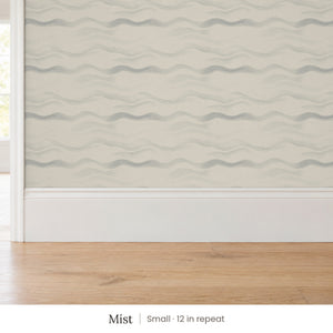 Lyme Mist peel and stick wallpaper, small 12 in repeat, above a white baseboard and oak floor