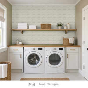 Lyme Mist peel and stick wallpaper, small 12 in repeat, in a laundry room with white cabinets and open shelves