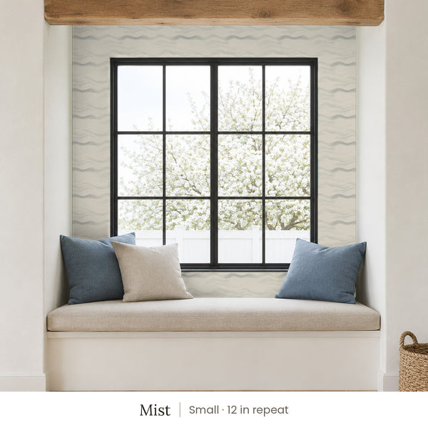 Lyme Mist peel and stick wallpaper, small 12 in repeat, in a window seat nook with blue cushions