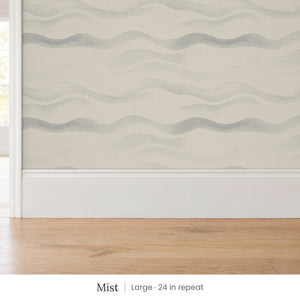 Lyme Mist peel and stick wallpaper, large 24 in repeat, above a white baseboard and oak floor