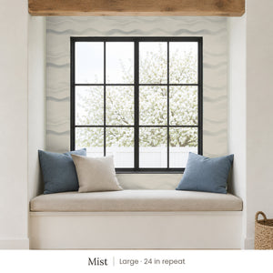 Lyme Mist peel and stick wallpaper, large 24 in repeat, in a window seat nook with blue cushions