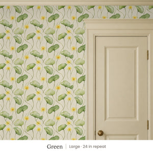 Zelda Green peel and stick wallpaper, large 24 in repeat, beside a cream panel door