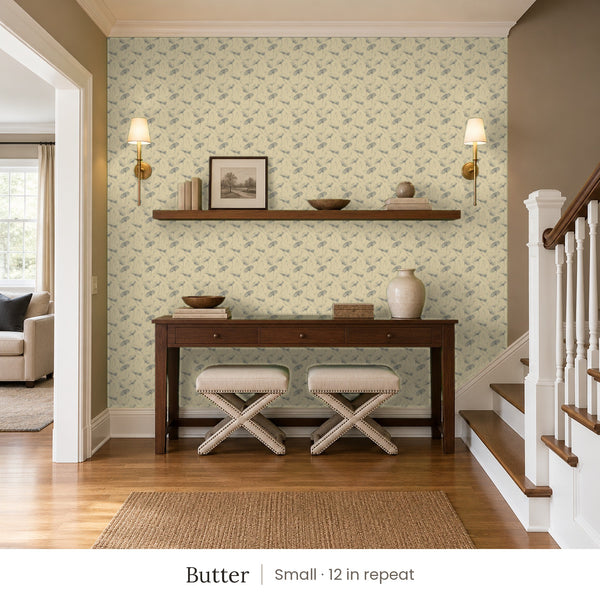 Zelda Butter peel and stick wallpaper, small 12 in repeat, in an entry with a wood console and a staircase