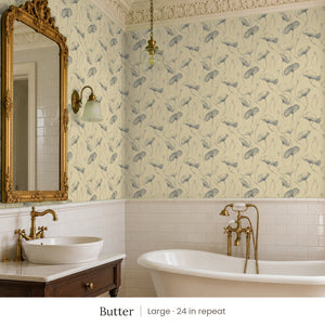 Zelda Butter peel and stick wallpaper, large 24 in repeat, in a bathroom with a gilded mirror and a vessel sink