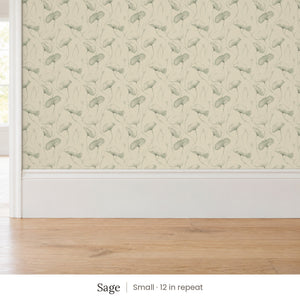 Zelda Sage peel and stick wallpaper, small 12 in repeat, above a white baseboard and oak floor