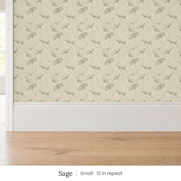 Zelda Sage peel and stick wallpaper, small 12 in repeat, above a white baseboard and oak floor