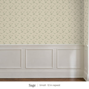 Zelda Sage peel and stick wallpaper, small 12 in repeat, above white panel wainscoting
