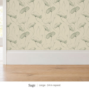 Zelda Sage peel and stick wallpaper, large 24 in repeat, above a white baseboard and oak floor