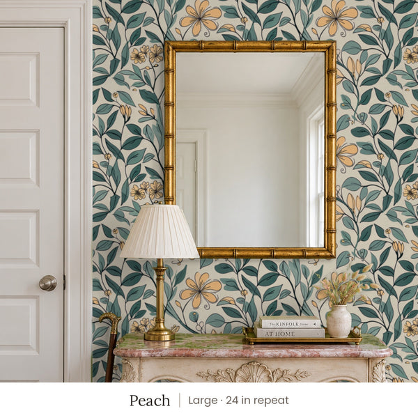 Marlow Peach peel and stick wallpaper, large 24 in repeat, in an entry with a gold mirror and a carved console