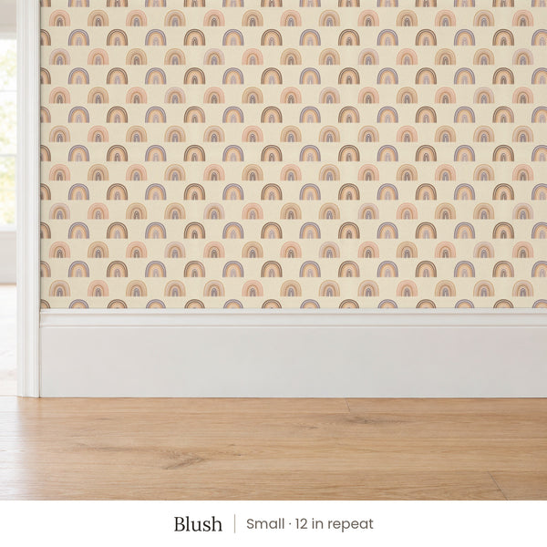 Over the Rainbow Blush peel and stick wallpaper, small 12 in repeat, above a white baseboard and oak floor