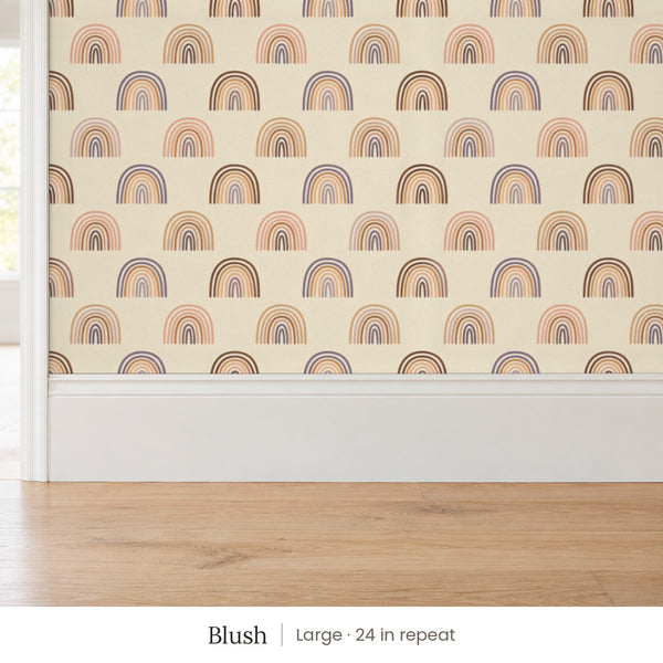Over the Rainbow Blush peel and stick wallpaper, large 24 in repeat, above a white baseboard and oak floor