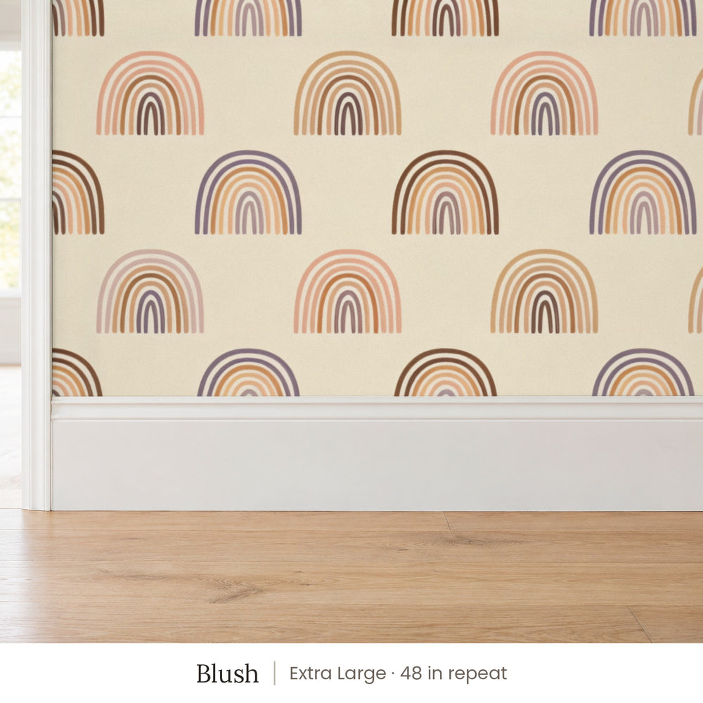 Over the Rainbow Blush peel and stick wallpaper, extra large 48 in repeat, above a white baseboard and oak floor