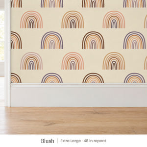 Over the Rainbow Blush peel and stick wallpaper, extra large 48 in repeat, above a white baseboard and oak floor