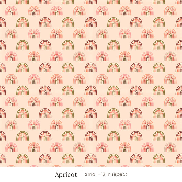 Over the Rainbow wallpaper in Apricot, small 12 in repeat, pink, coral and olive rainbows on peach