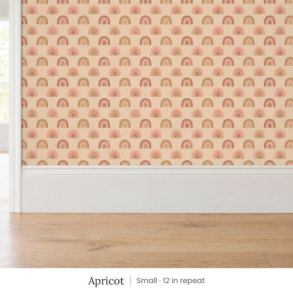 Over the Rainbow Apricot peel and stick wallpaper, small 12 in repeat, above a white baseboard and oak floor