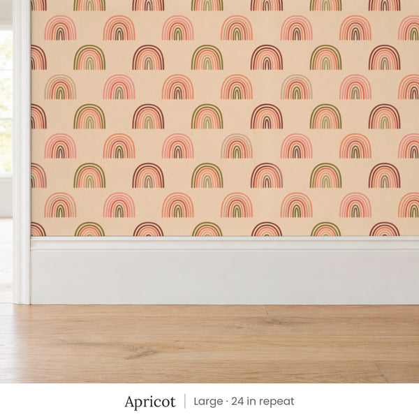 Over the Rainbow Apricot peel and stick wallpaper, large 24 in repeat, above a white baseboard and oak floor