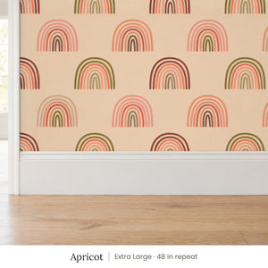 Over the Rainbow Apricot peel and stick wallpaper, extra large 48 in repeat, above a white baseboard and oak floor