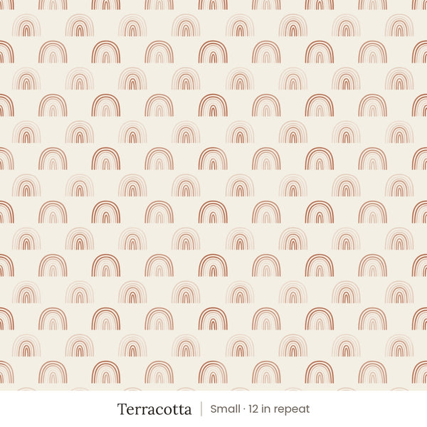 Over the Rainbow wallpaper in Terracotta, small 12 in repeat, soft terracotta and blush rainbows on cream