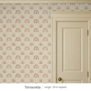 Over the Rainbow Terracotta peel and stick wallpaper, large 24 in repeat, beside a cream panel door