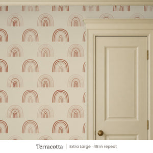 Over the Rainbow Terracotta peel and stick wallpaper, extra large 48 in repeat, beside a cream panel door