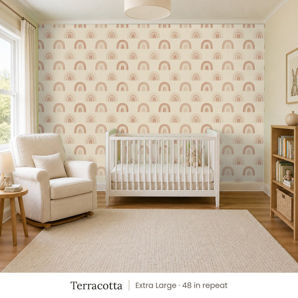 Over the Rainbow Terracotta peel and stick wallpaper, extra large 48 in repeat, in a nursery with a white crib and an armchair