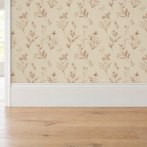Pippa Rose peel and stick wallpaper above a white baseboard and oak floor