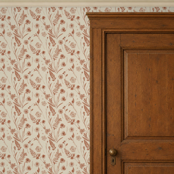 Cecily Terracotta peel and stick wallpaper beside a dark wood panel door