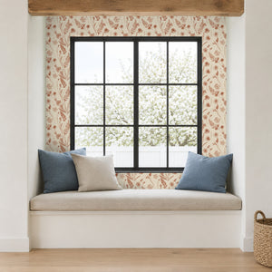 Cecily Terracotta peel and stick wallpaper in a window seat nook with blue cushions