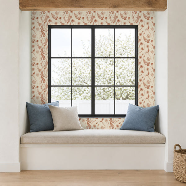 Cecily Terracotta peel and stick wallpaper in a window seat nook with blue cushions