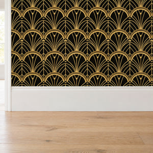 Tabitha Gold peel and stick wallpaper above a white baseboard and oak floor