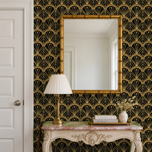 Tabitha Gold peel and stick wallpaper in an entry with a gold mirror and a carved console