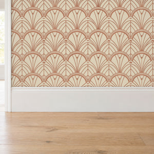 Tabitha Copper peel and stick wallpaper above a white baseboard and oak floor
