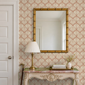 Tabitha Copper peel and stick wallpaper in an entry with a gold mirror and a carved console