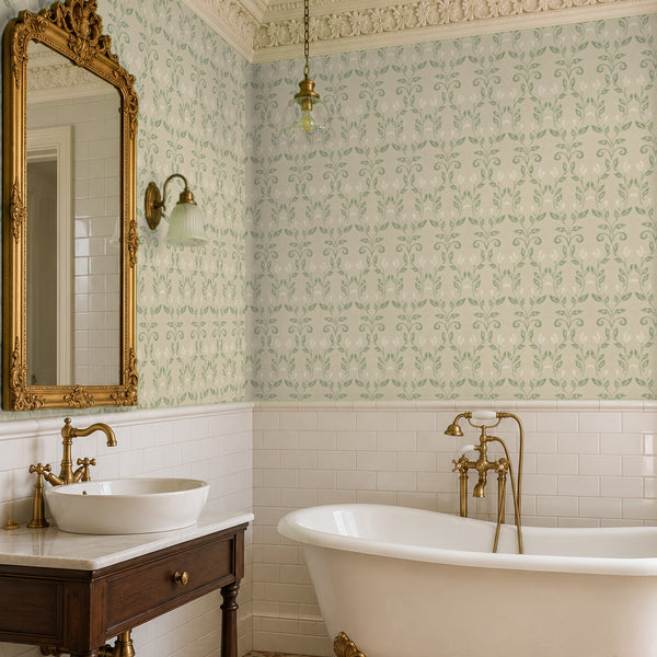 Quince Sage peel and stick wallpaper in a bathroom with a gilded mirror and a vessel sink
