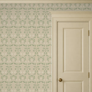 Quince Sage peel and stick wallpaper beside a cream panel door