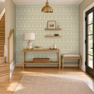Quince Sage peel and stick wallpaper in an entry with a console table beside the stairs