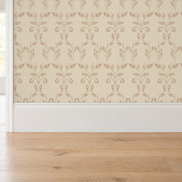 Quince Blush peel and stick wallpaper above a white baseboard and oak floor