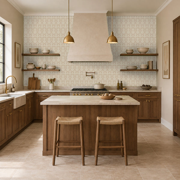 Quince Blush peel and stick wallpaper in a kitchen with a wood island and brass pendants