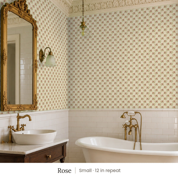 Tamsin Rose peel and stick wallpaper, small 12 in repeat, in a bathroom with a gilded mirror and a vessel sink