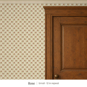Tamsin Rose peel and stick wallpaper, small 12 in repeat, beside a dark wood panel door