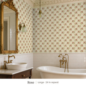 Tamsin Rose peel and stick wallpaper, large 24 in repeat, in a bathroom with a gilded mirror and a vessel sink