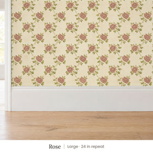 Tamsin Rose peel and stick wallpaper, large 24 in repeat, above a white baseboard and oak floor