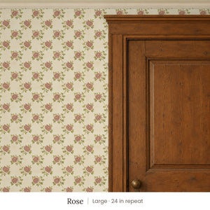 Tamsin Rose peel and stick wallpaper, large 24 in repeat, beside a dark wood panel door