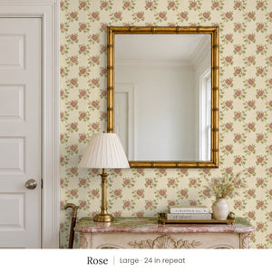 Tamsin Rose peel and stick wallpaper, large 24 in repeat, in an entry with a gold mirror and a carved console
