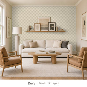 Tamsin Dove peel and stick wallpaper, small 12 in repeat, in a family room with a cream sofa and tan leather armchairs